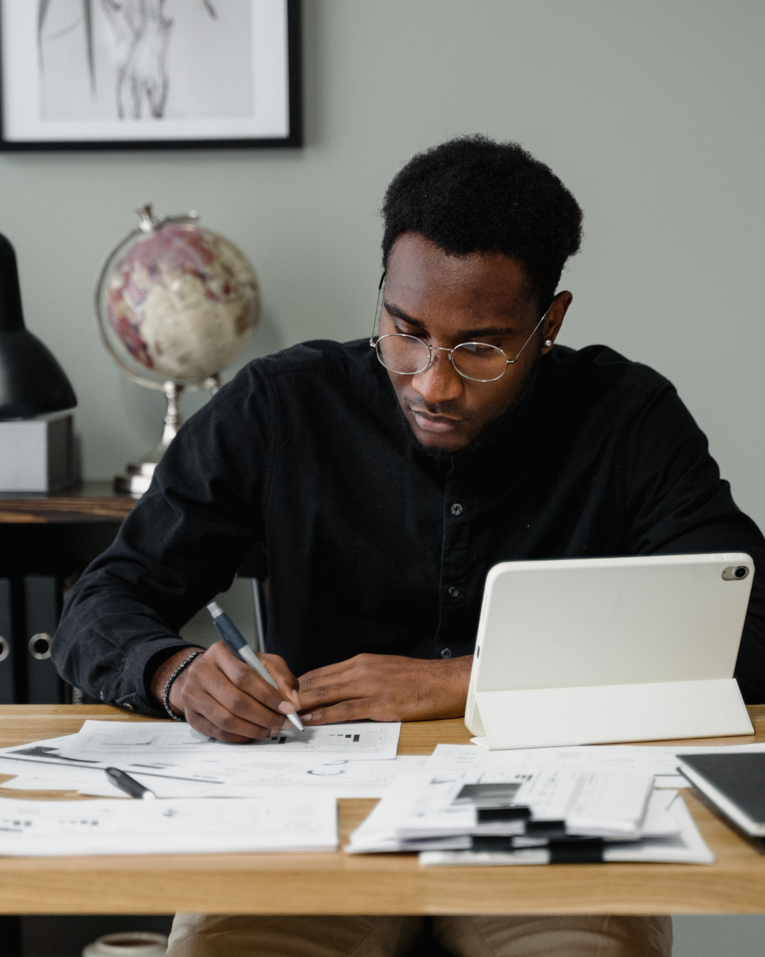 man doing paperwork at desk